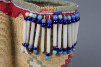 Nez%20Perce%20artist%2C%20%3Cb%3E%3Ci%3E%20Pouch%3C%2Fi%3E%3C%2Fb%3E%2C%20ca.%201890%2C%20cornhusk%20with%20commerical%20dye%2C%20cotton%20fabric%2C%20dentalia%20shells%2C%20glass%20beads%2C%20shell%2C%20and%20hide%20strips%2C%20The%20Elizabeth%20Cole%20Butler%20Collection%2C%20no%20known%20copyright%20restrictions%2C%202012.126.30